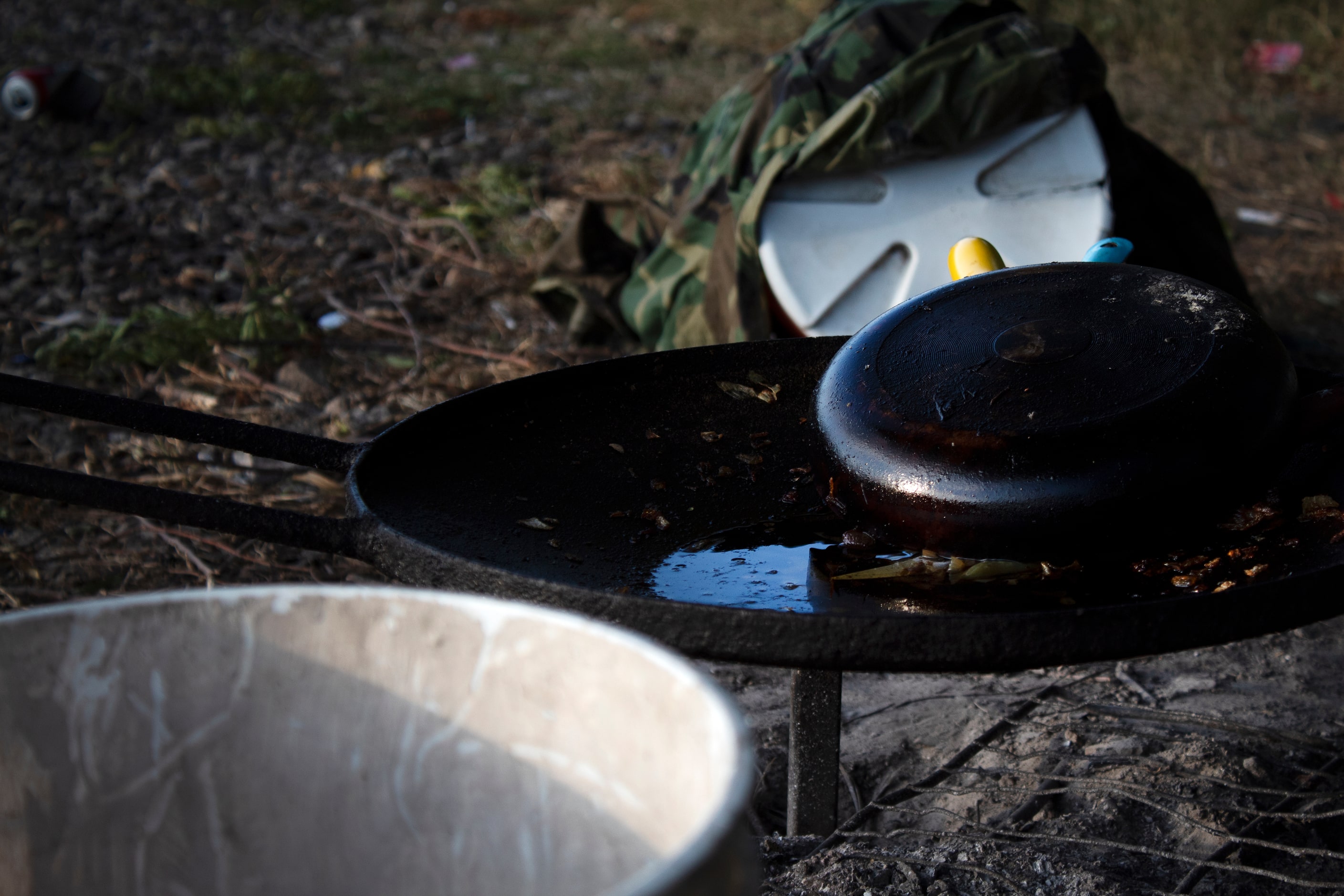 McKinney, Texas 10/10/2021 A pan covers cooked green peppers and onions to prevent...