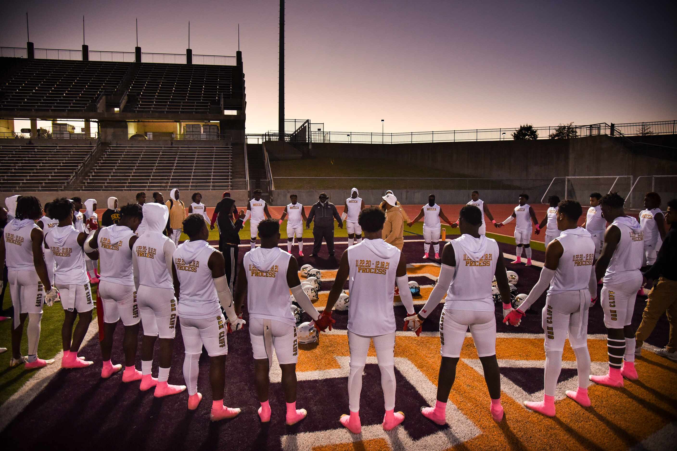 South Oak Cliff players pray together before the start of the District 6-5A Division II...