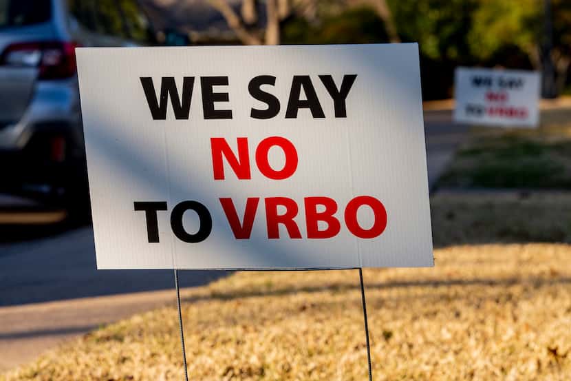 Lochwood residents in northeast Dallas posted “We say no to VRBO” signs after difficulties...