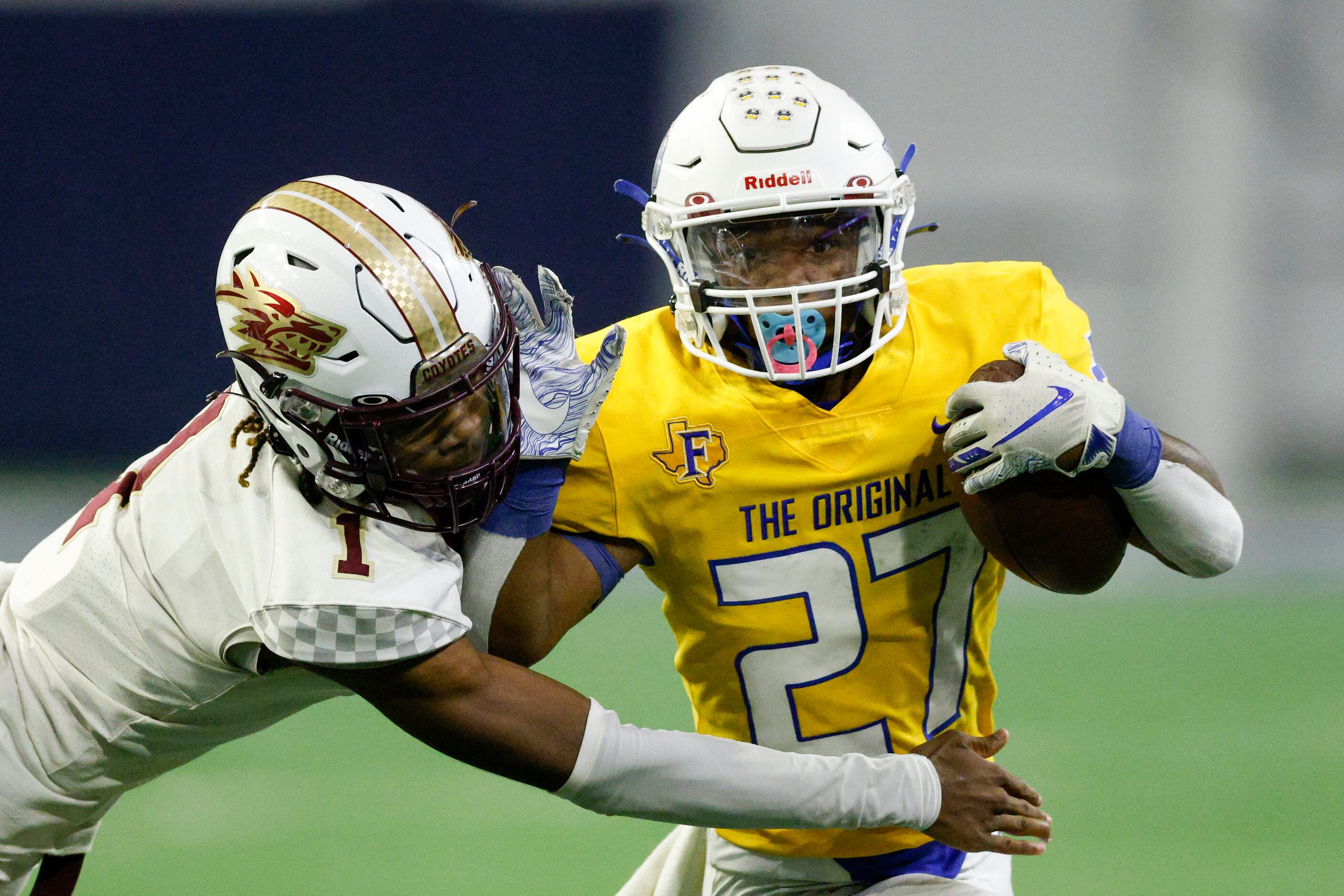 Frisco Heritage defensive back Kameron Franklin (1) tackles Frisco running back Kam...