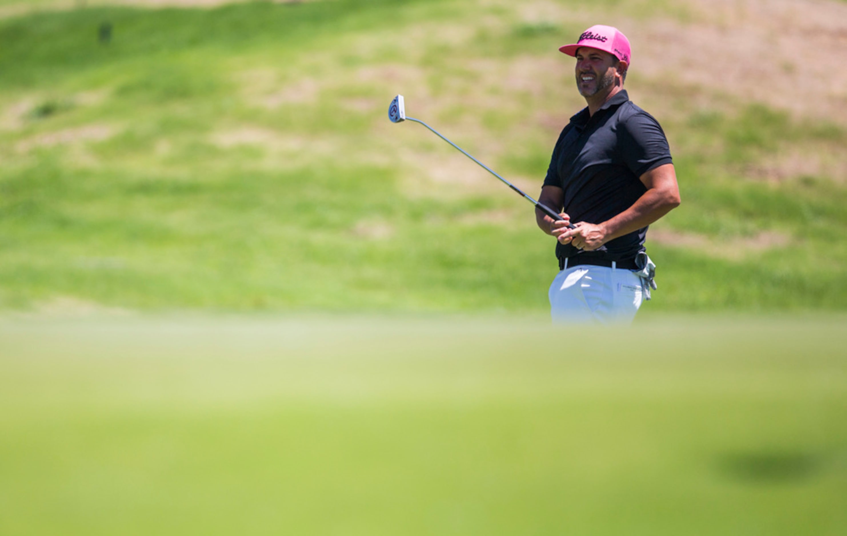 Scott Piercy takes a shot on the fifth green during round 4 of the AT&T Byron Nelson golf...