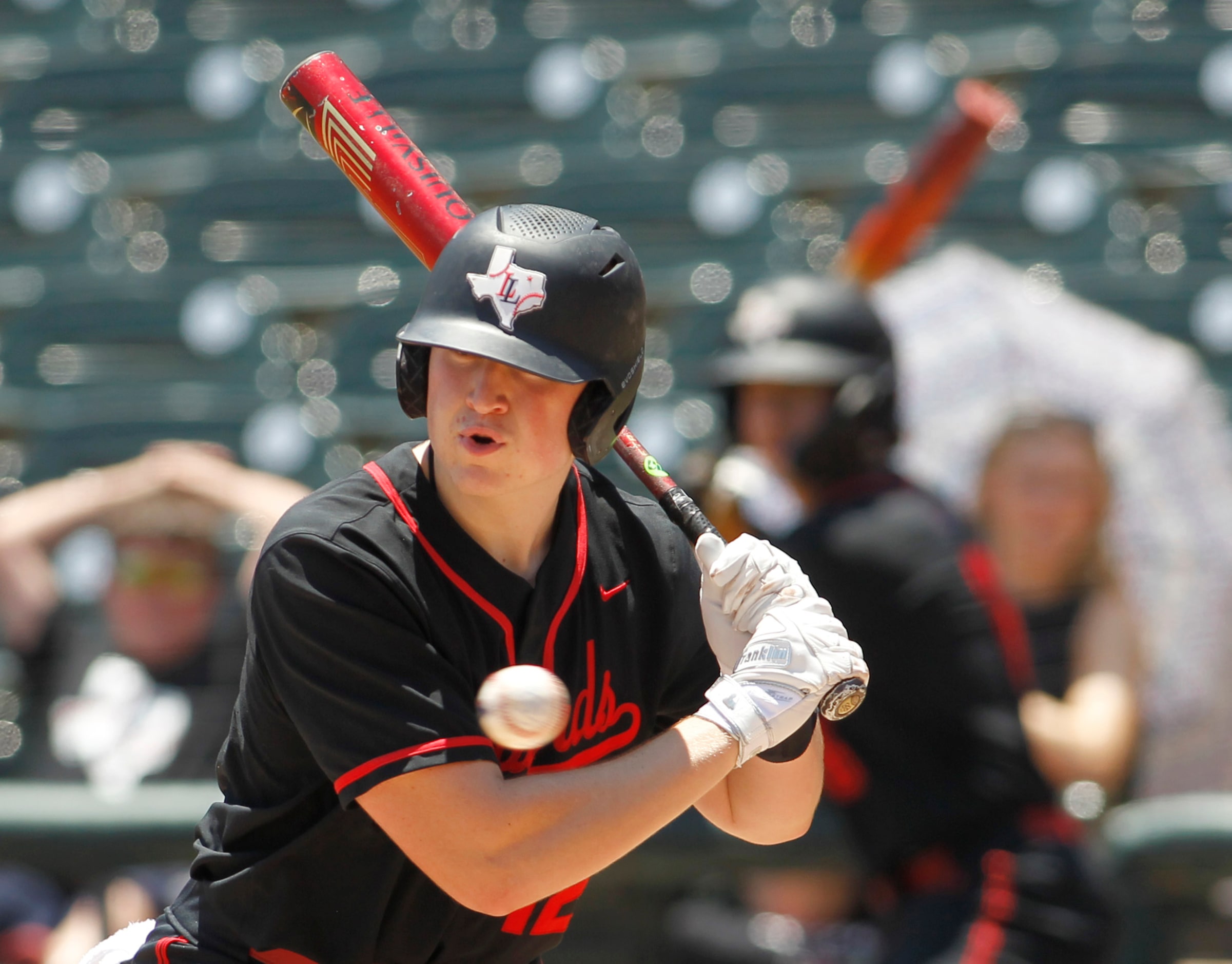 Lovejoy catcher Reese Ogden (12) takes a pitch while batting in the top of the first inning...