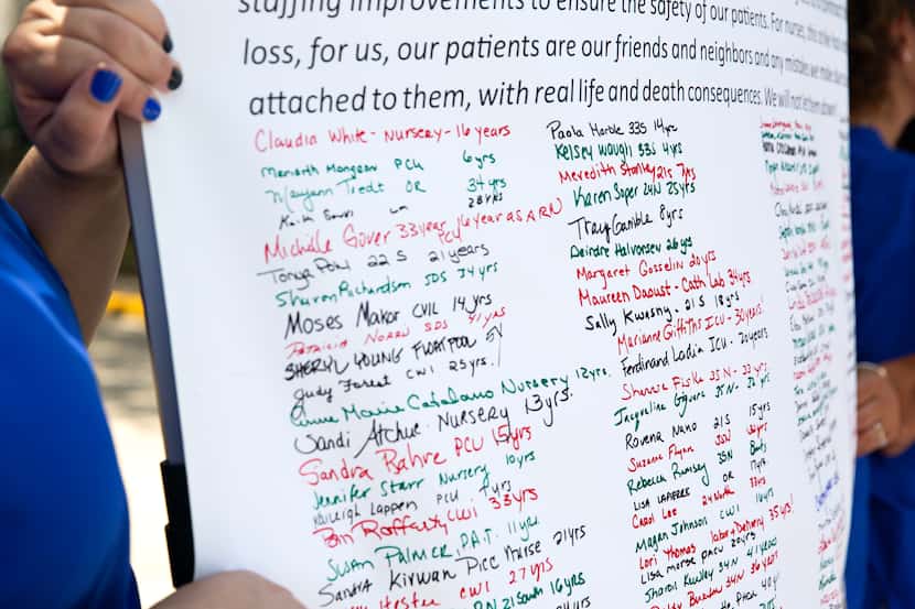 A 16-foot-long petition signed by 700 striking nurses was delivered to Tenet Healthcare’s...