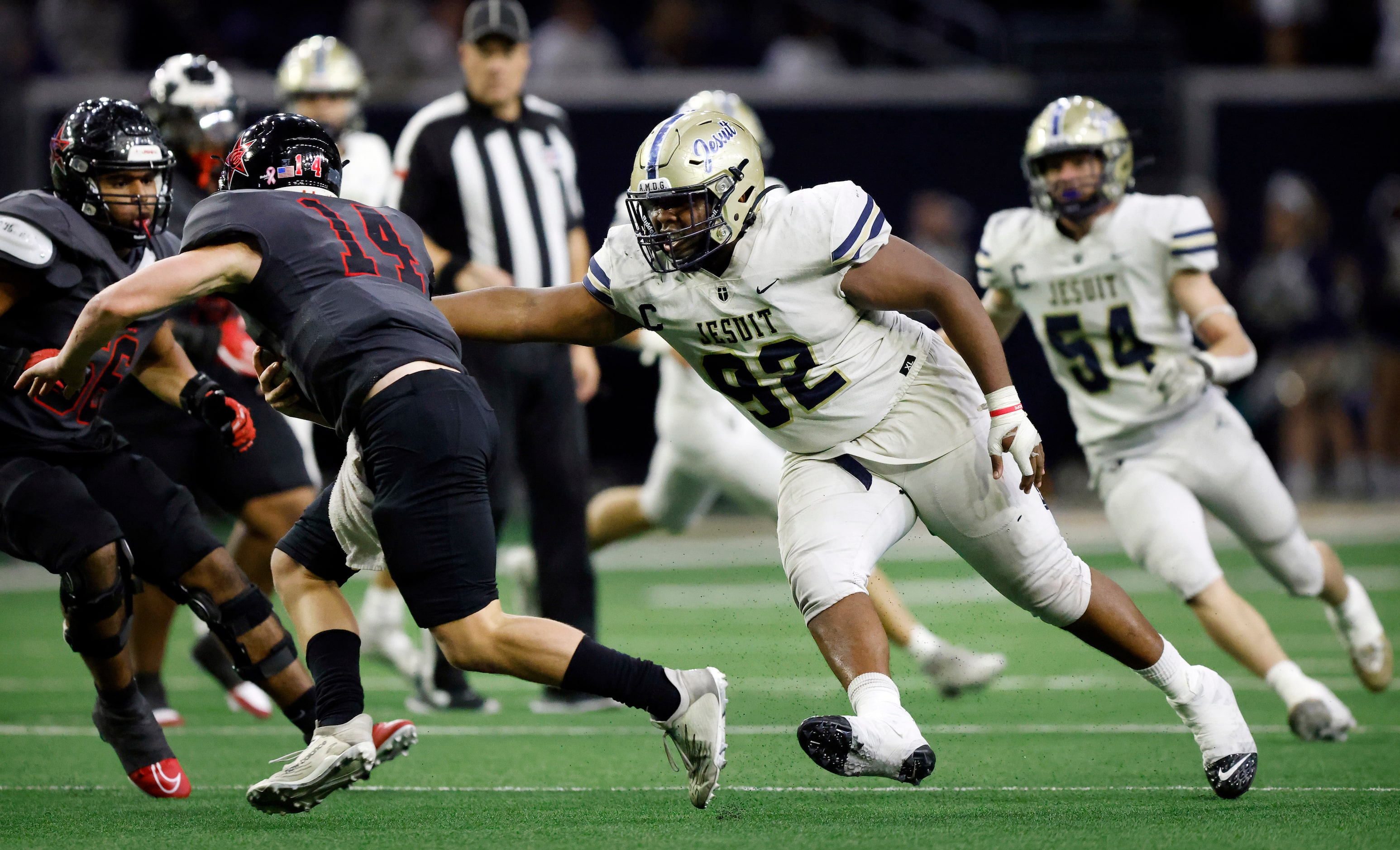 Jesuit defensive lineman Chris Simington (92) grabs hold of Coppell quarterback Edward...