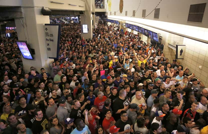 WWE fans fill the concourse before WrestleMania 32 at AT&T Stadium in Arlington, TX, Sunday,...
