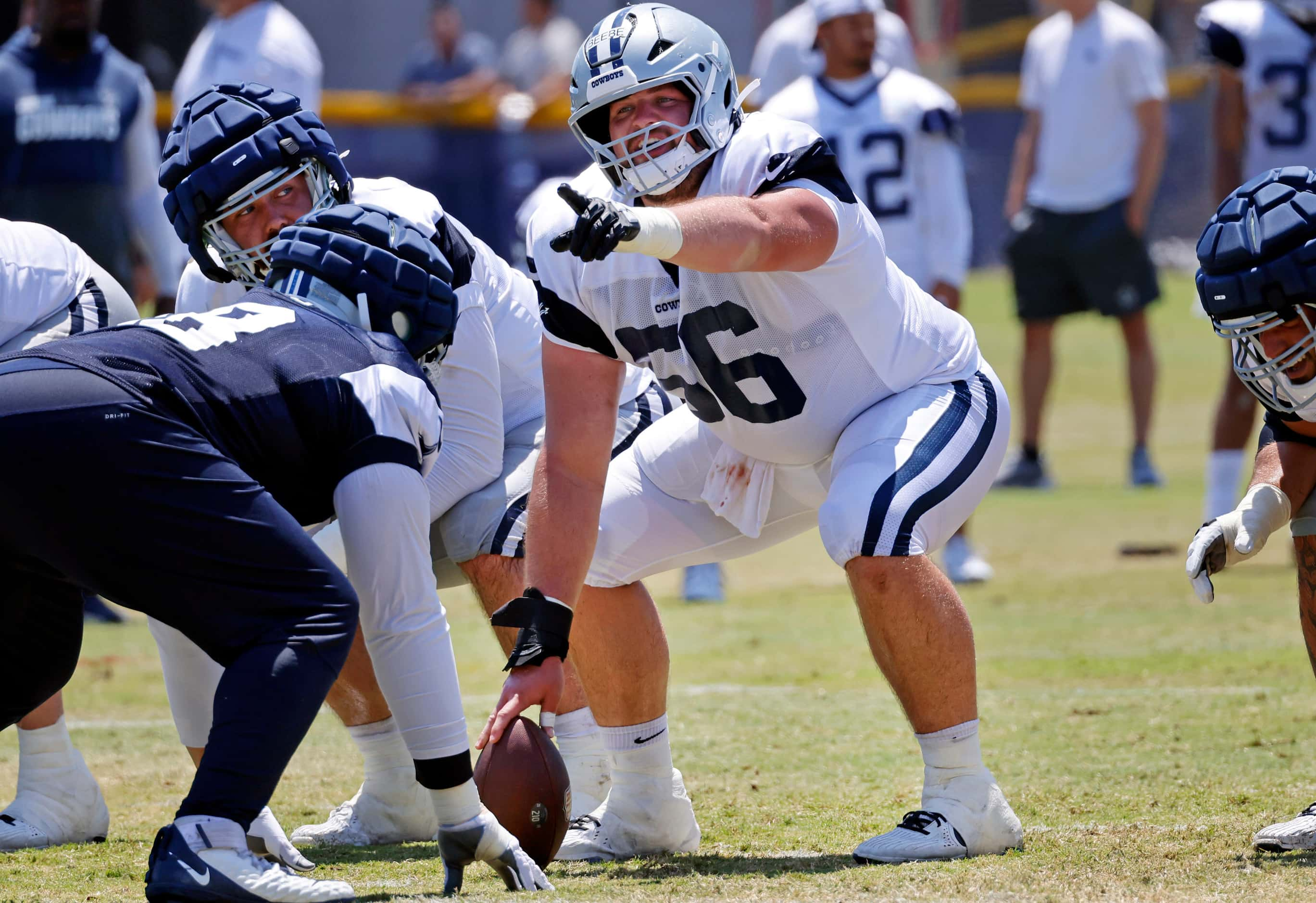 Dallas Cowboys rookie center Cooper Beebe (56) points out the coverage as they face the...