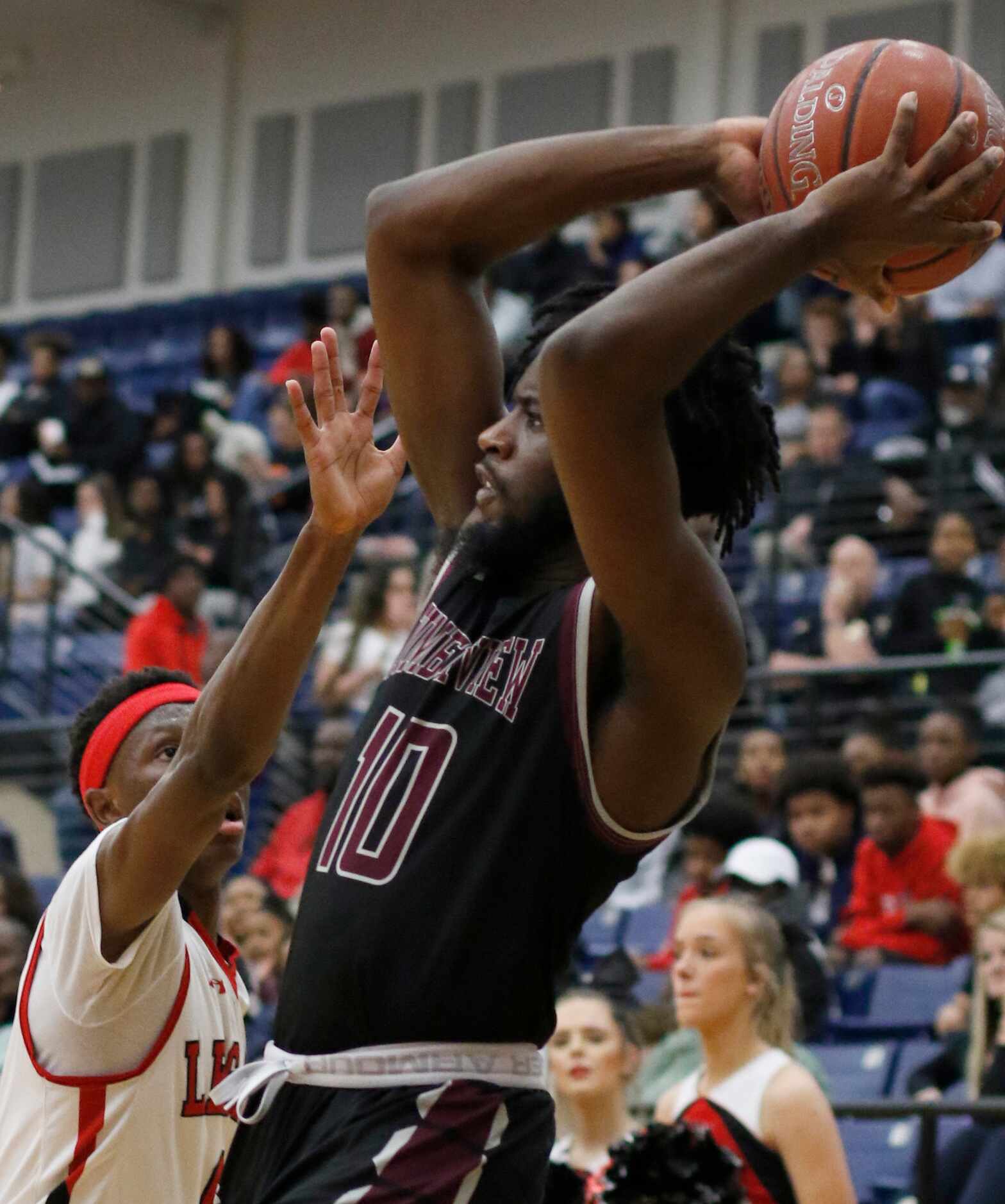 Mansfield Timberview guard Ahmad Richardson (10) looks to pass to a teammate after pulling...