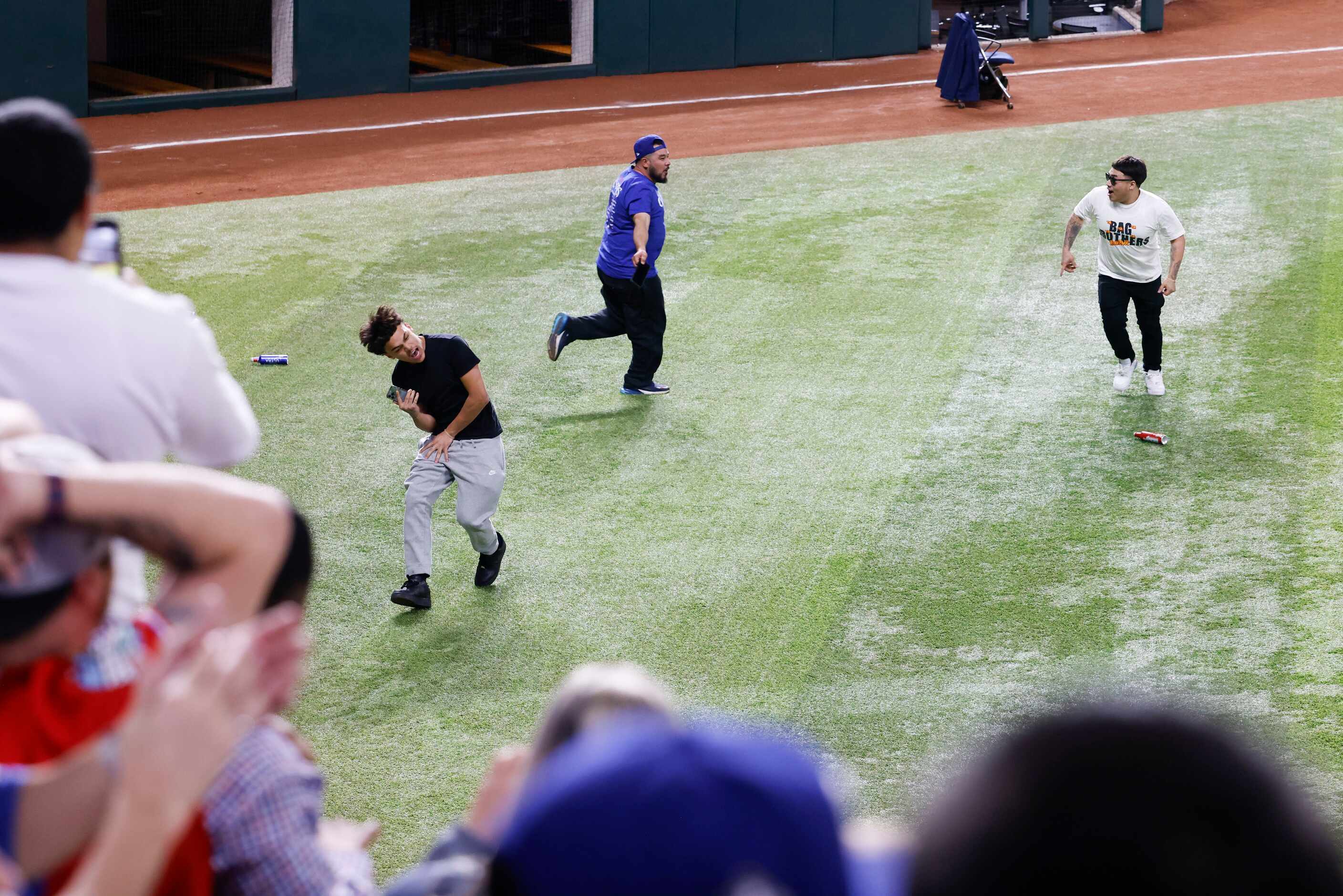 Some Texas Rangers fans ran onto the field following Texas Rangers’ winning the World Series...