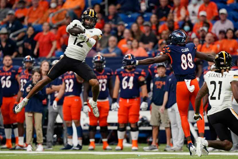 Southern Mississippi defensive back Eric Scott Jr. (12) intercepts a pass intended for UTSA...