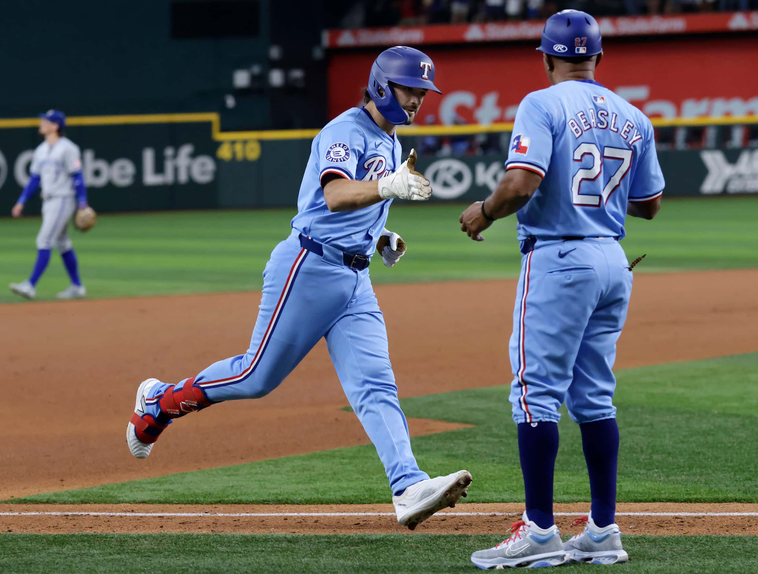 Texas Rangers Josh Smith (left) is congratulated on his solo home run against the Kansas...