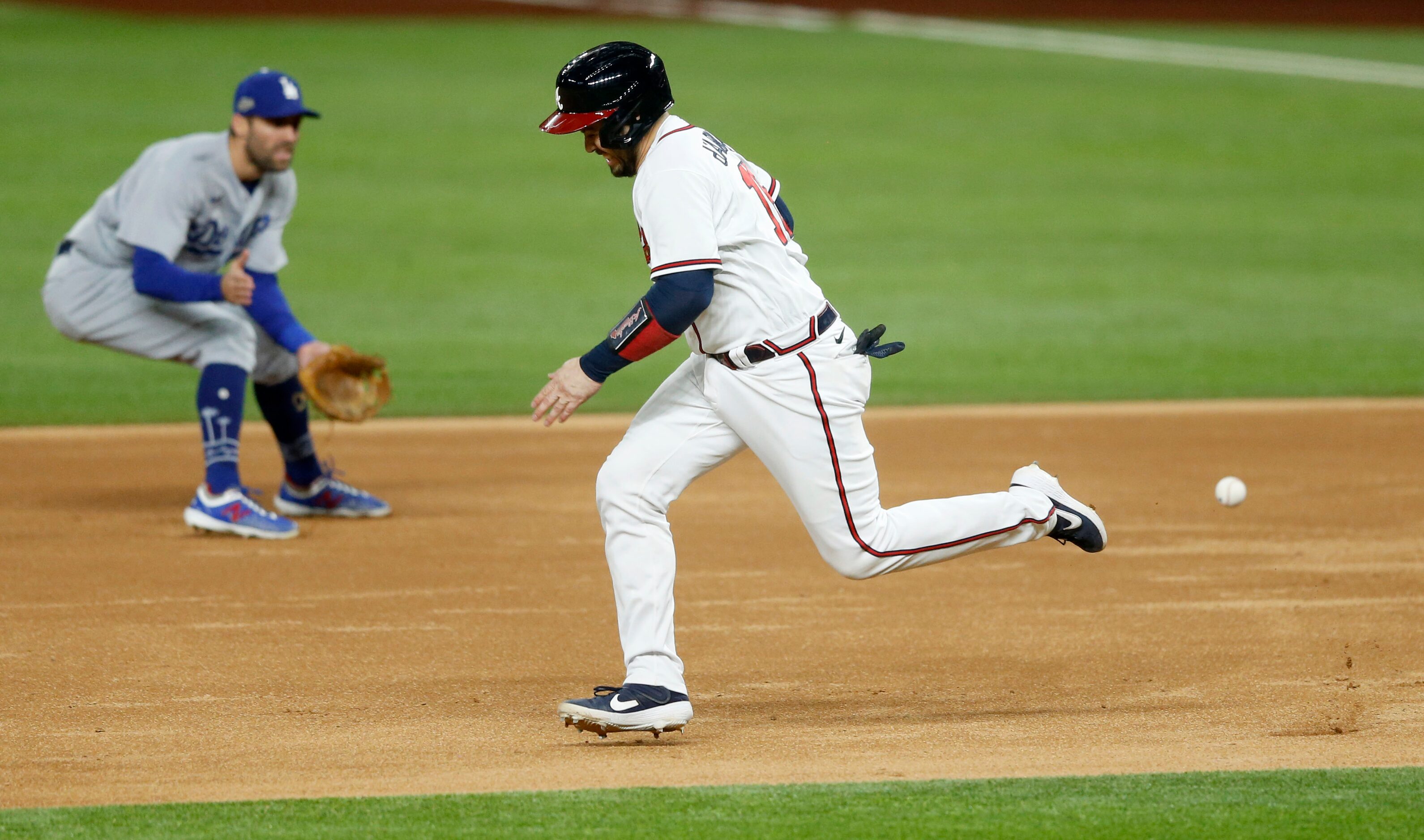 Atlanta Braves catcher Travis d'Arnaud (16) runs to second base as Los Angeles Dodgers...