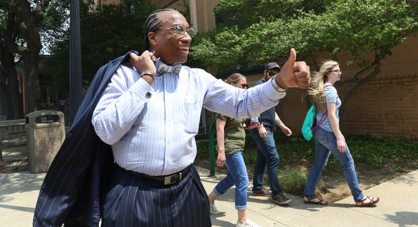 Dallas County Commissioner John Wiley Price gives thumbs up to a supporter in downtown...