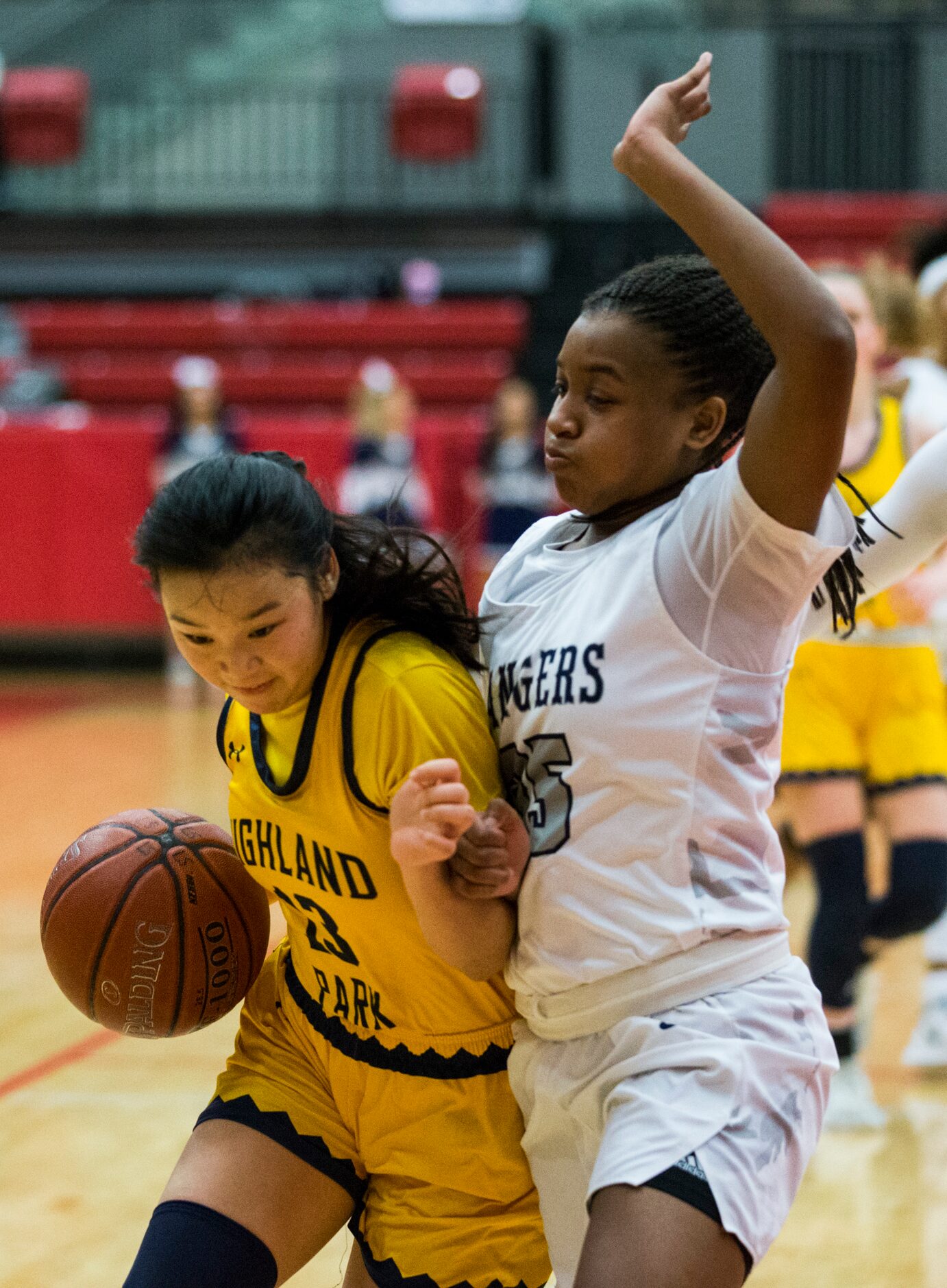 Highland Park guard Vivian Jinn (13) tries to get around Frisco Lone Star forward Laila...