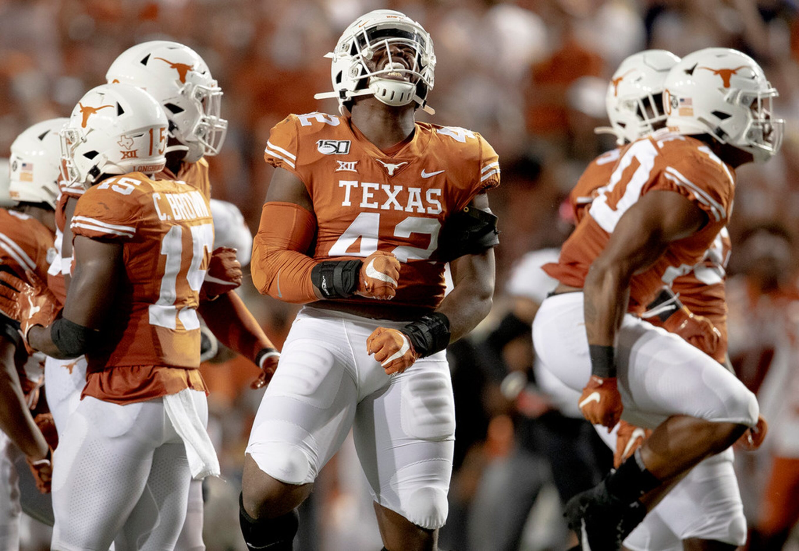 Texas defensive lineman Marqez Bimage (42) celebrates a defensive stop against Oklahoma...