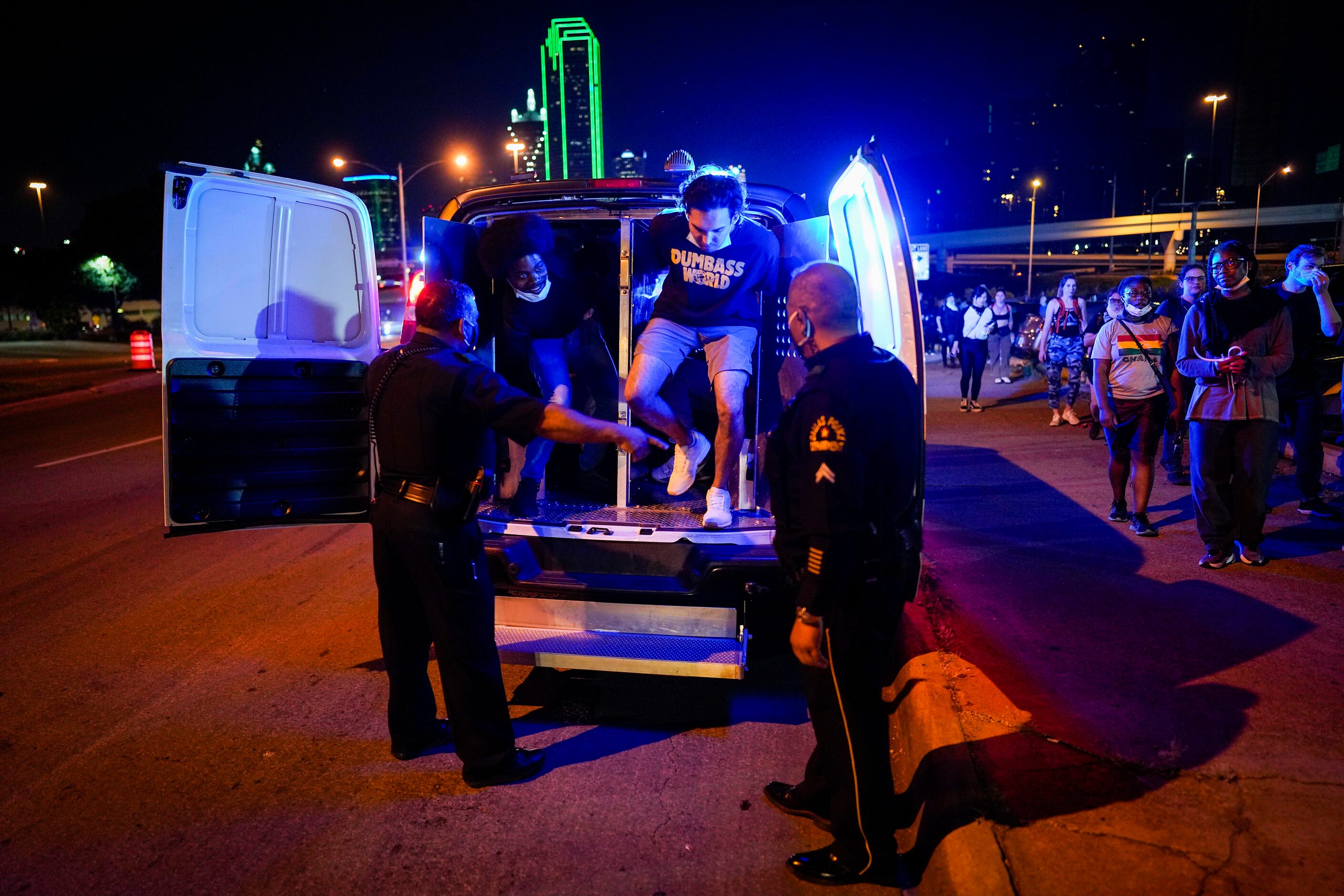 Protesters are released outside the Frank Crowley Courthouse after being arrested on the...