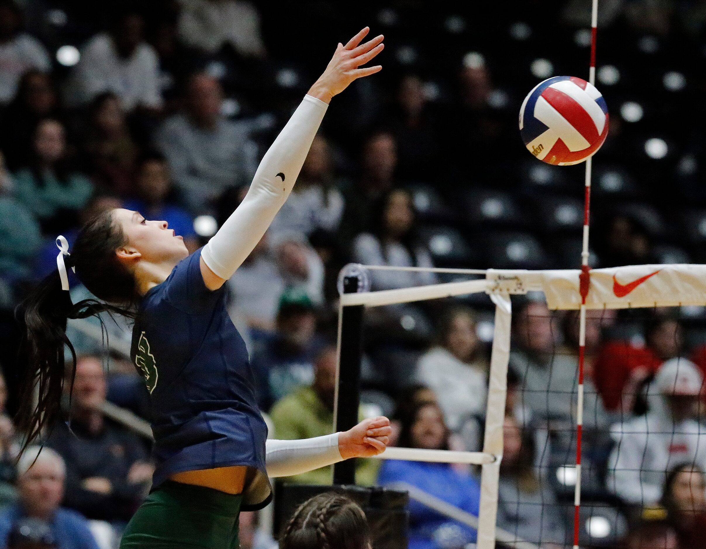 Reedy High School's Halle Schroder (18) attempts a hit during game three as Colleyville...