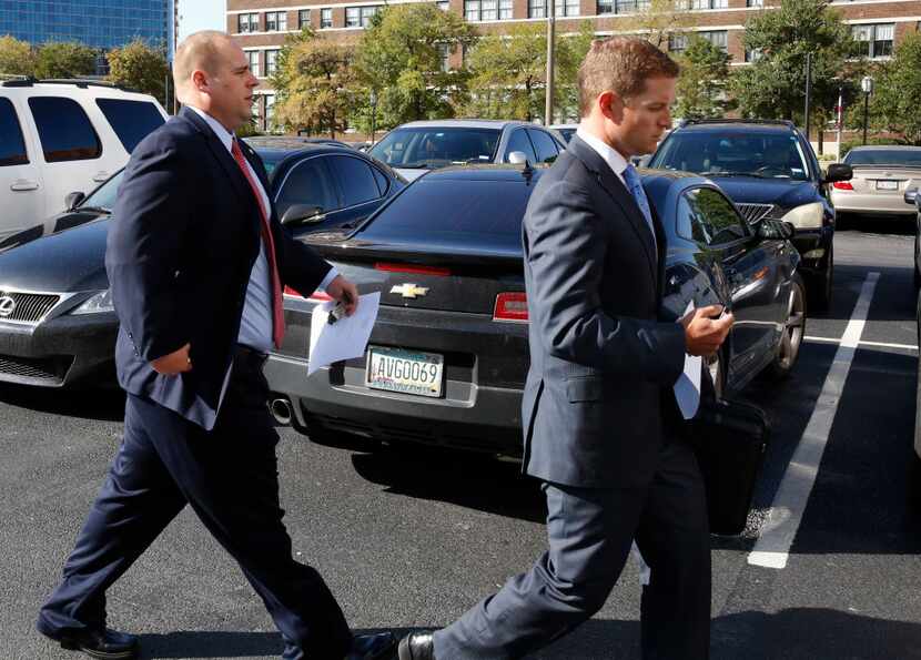 Blackstone walks to his vehicle with his lawyer after pleading guilty in federal court in...