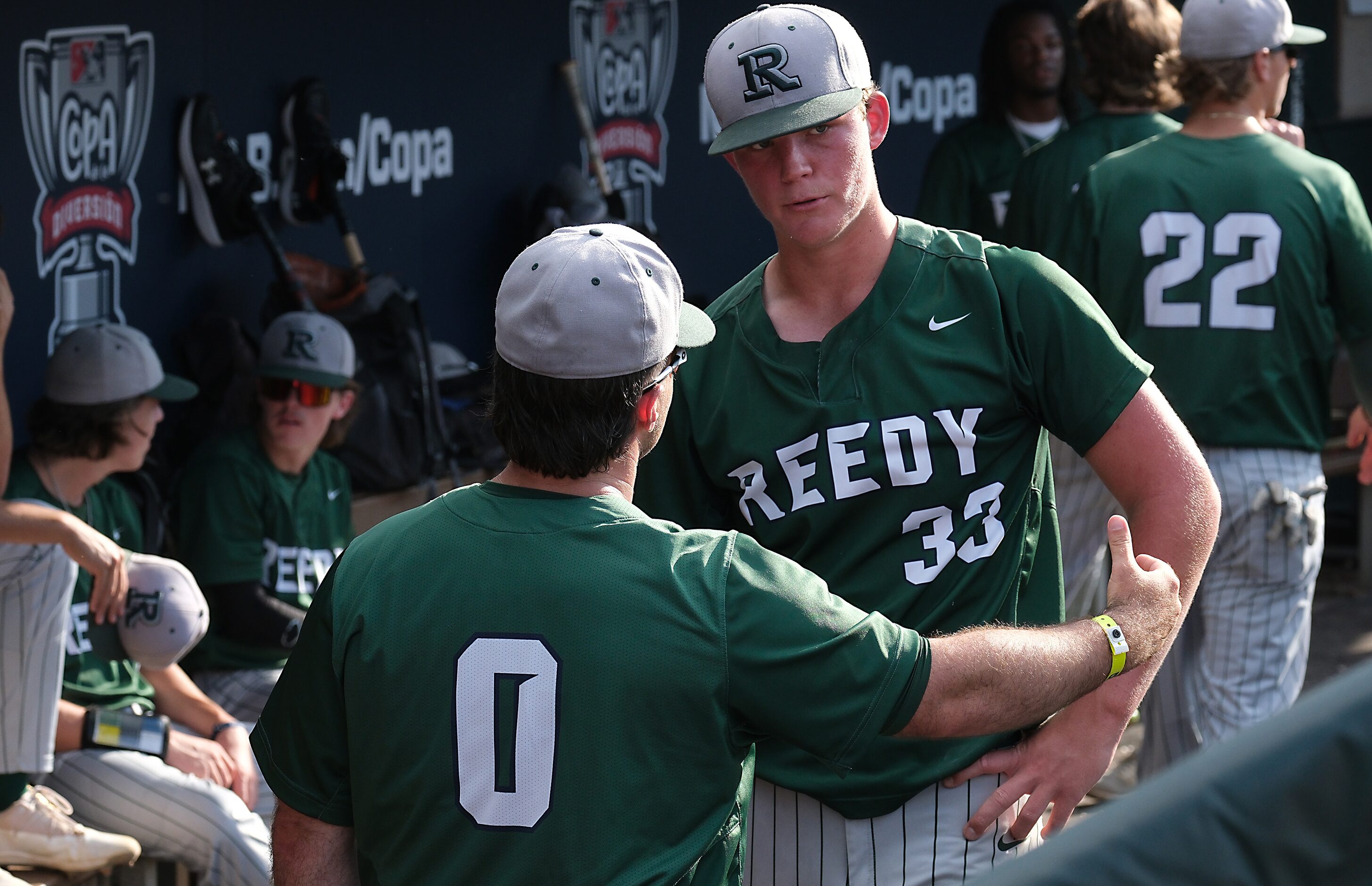 Frisco Reedy head coach, Mickey Sepanek, (0), speaks with starting pitcher Will Johnson,...