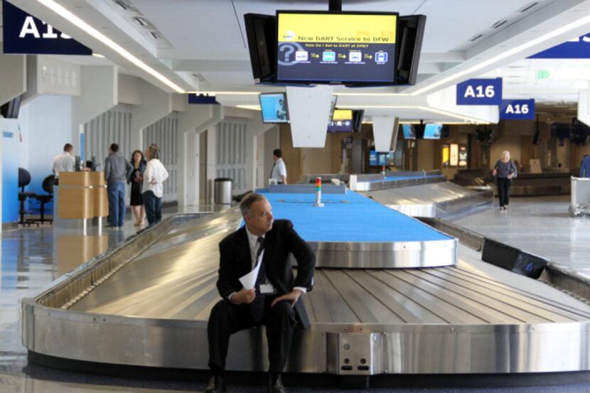 Chauffeur Roger Hastings waited alone at baggage claim in Terminal A to pick up a passenger...