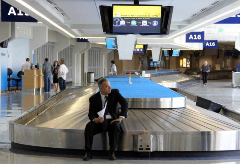 Chauffeur Roger Hastings waited alone at baggage claim in Terminal A to pick up a passenger...