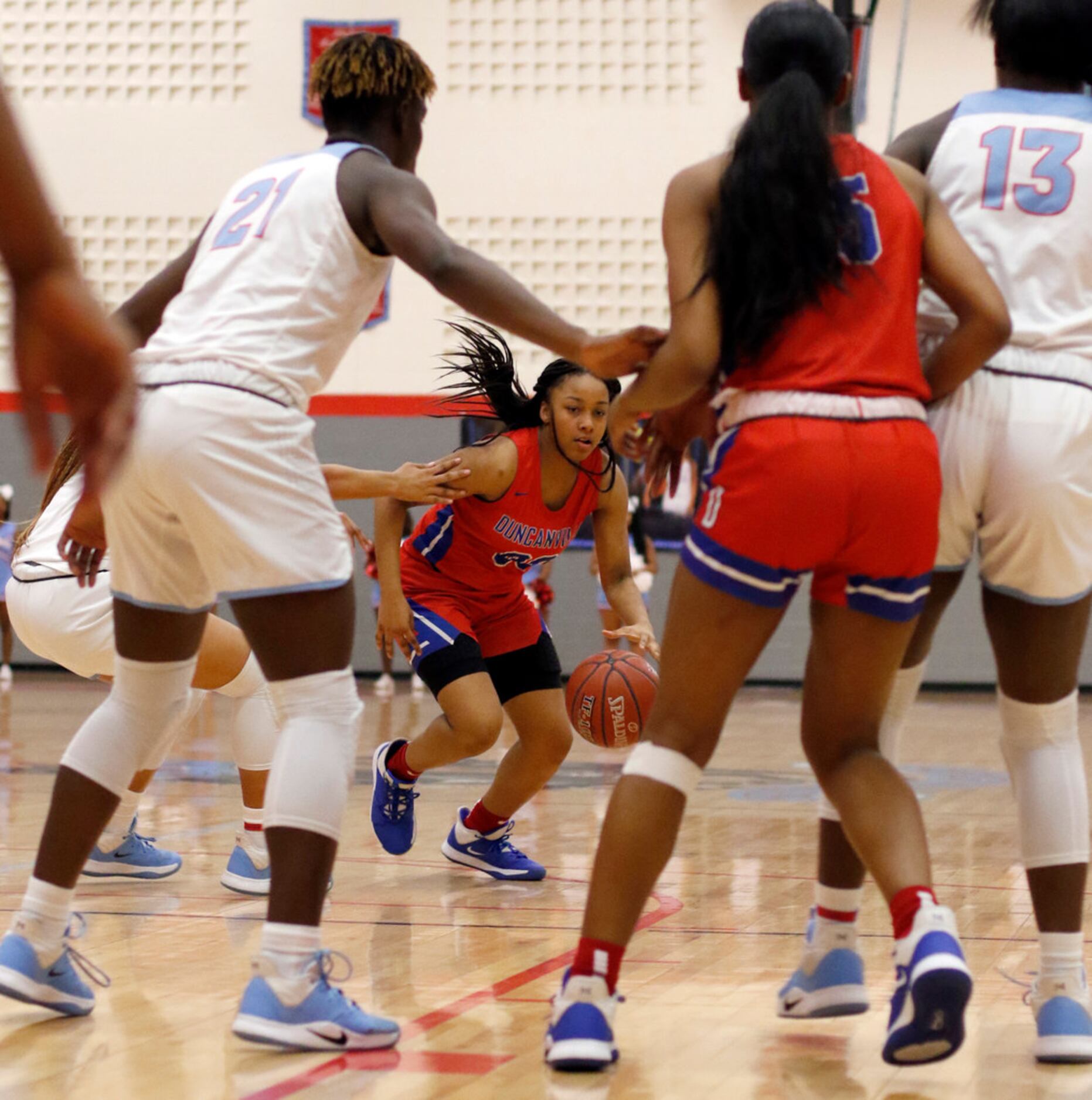 Duncanville's Hope LeMelle (00) dribbles into traffic during first half action against...