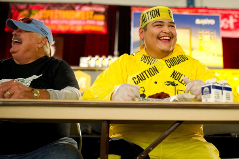 Gino Lopez digs in during WingStop's "atomic" wing-eating contest at ZestFest in 2019.