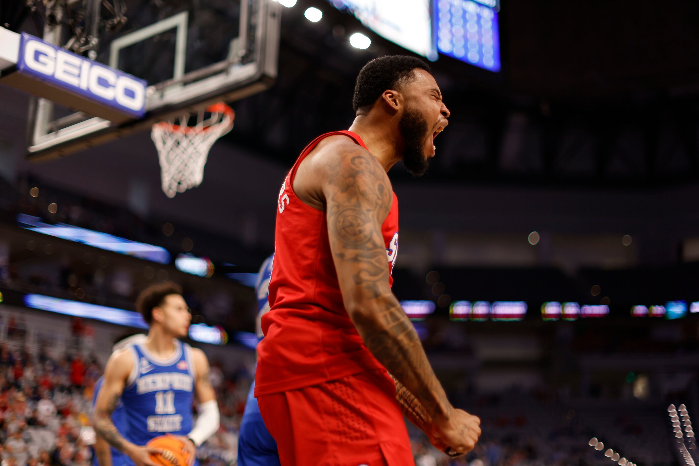 SMU forward Marcus Weathers (50) reacts to a foul by Memphis guard Lester Quinones (11)...