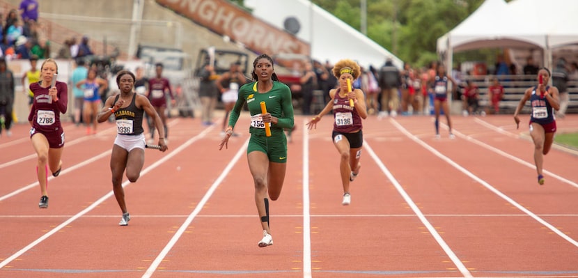 Desoto's Rosaline Effiong (1561) leads the pack as she heads toward the finish during the...