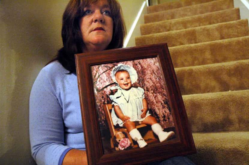 Petti McClellan holds a photo of her daughter, Chelsea McClellan, in 2005. Former nurse...