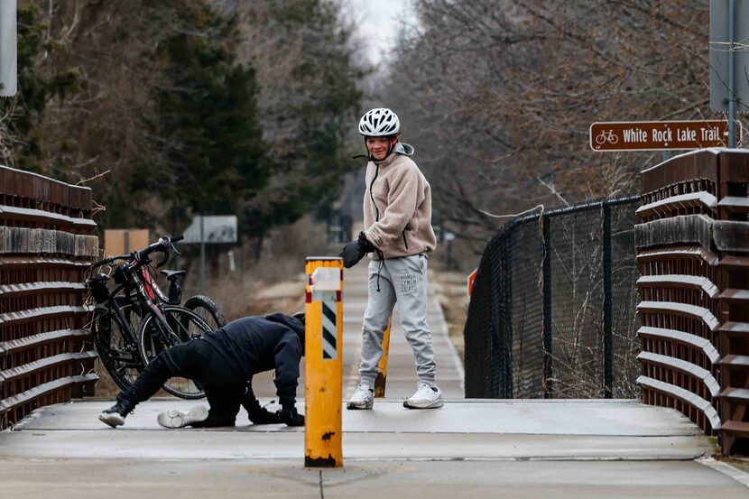 With Colin Neely (right) looking on, William Heatly tried to stand up after falling on an...