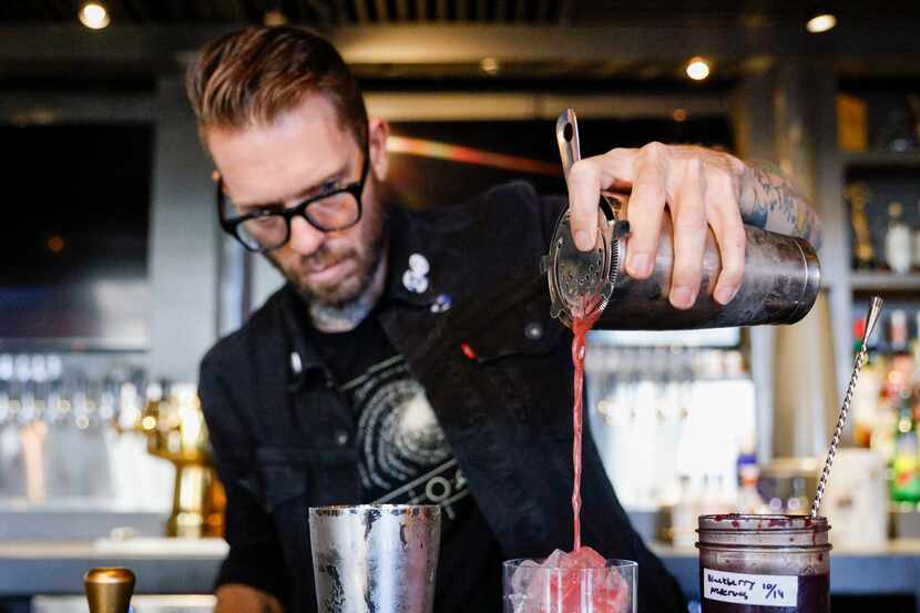 Beverage director Alexander Fletcher prepares the Can’t Hardly Wait cocktail at Henrys...