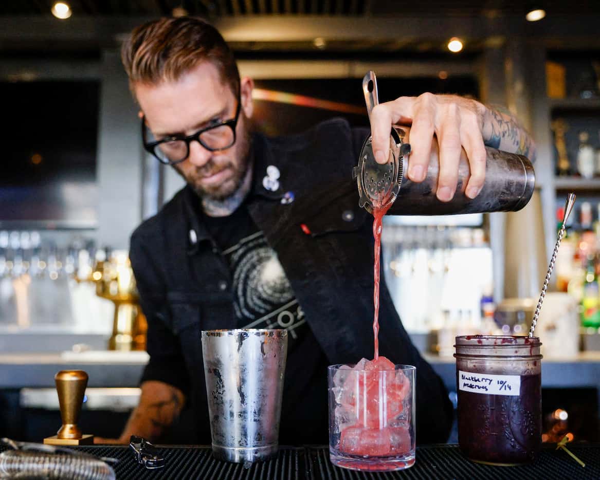 Beverage director Alexander Fletcher prepares the Can’t Hardly Wait cocktail at Henrys...