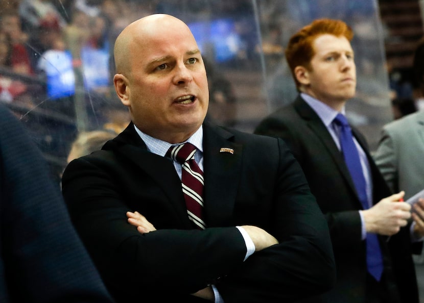 FILE - In this March 25, 2017, file photo, Denver head coach Jim Montgomery works the bench...