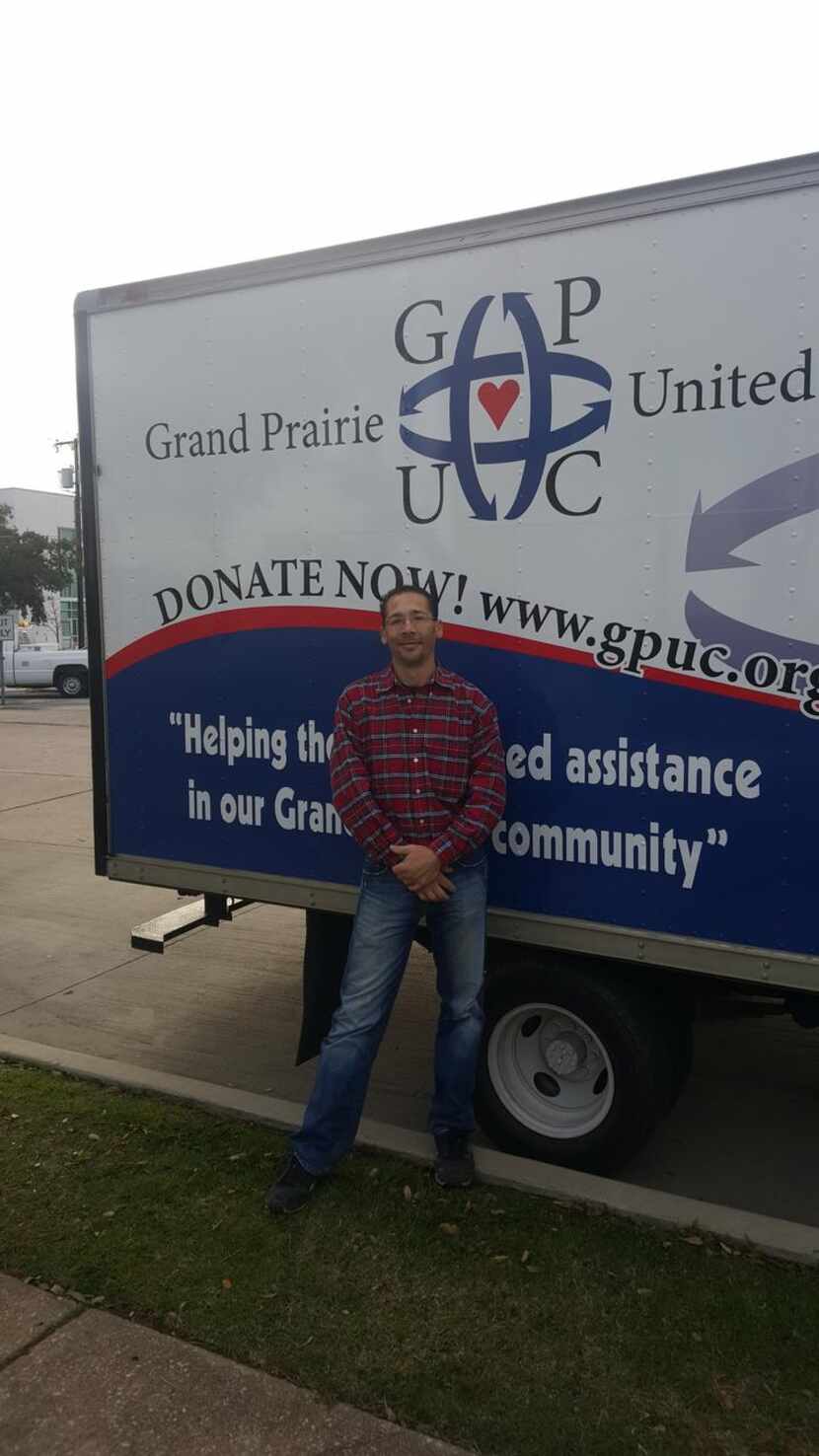 
Kevin Boley Jr. stands in front of the truck he restored and drives for Grand Prairie...