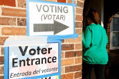 Voters enter the Ellis County Woman's Building during the state's primary election March 5...