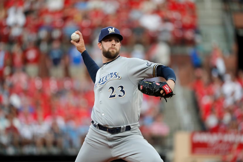 Milwaukee Brewers starting pitcher Jordan Lyles throws during the first inning of a baseball...