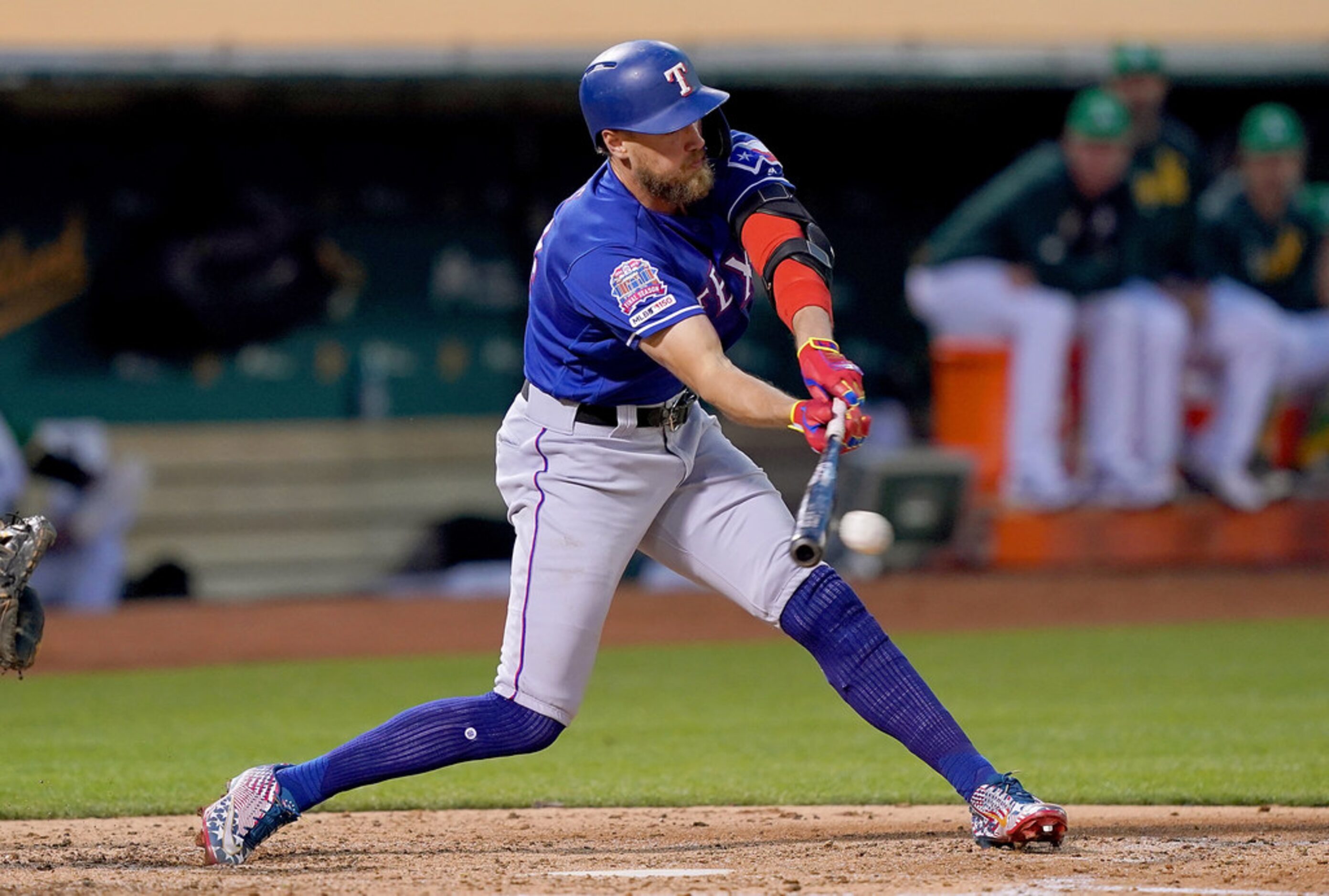 OAKLAND, CA - JULY 25:  Hunter Pence #24 of the Texas Rangers hits an rbi single scoring...