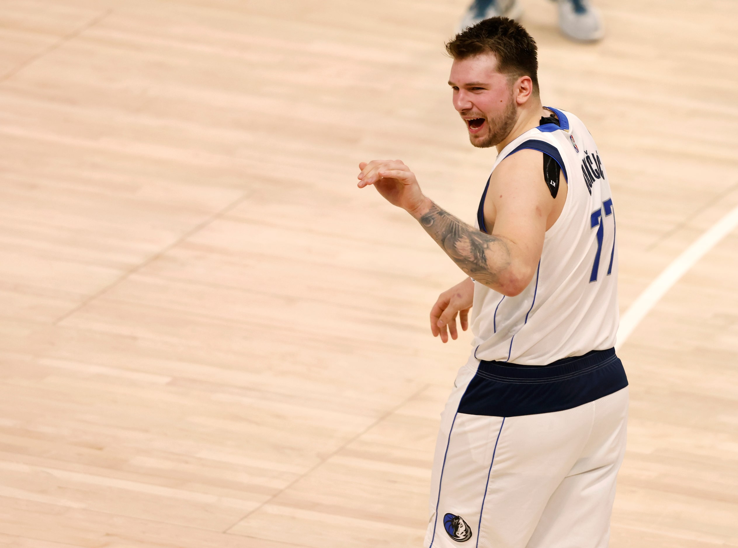 Dallas Mavericks guard Luka Doncic (77) waves bye towards the stands after game 6 of an NBA...