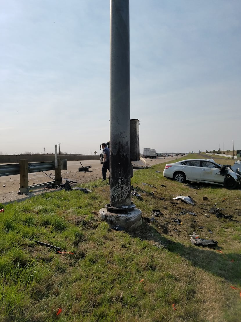 A Nissan Altima hit a light pole on an Interstate 35 frontage road in Denton on Tuesday...