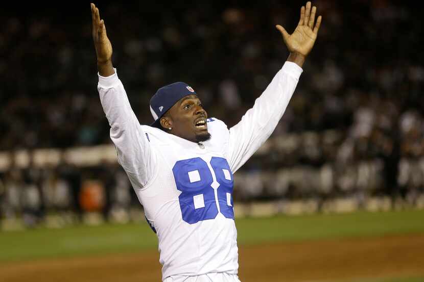 Dallas Cowboys wide receiver Dez Bryant (88) gestures as he watches a replay during the...