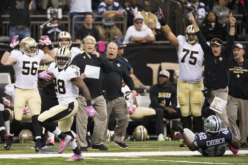 New Orleans Saints running back C.J. Spiller (28) gets past Dallas Cowboys strong safety...