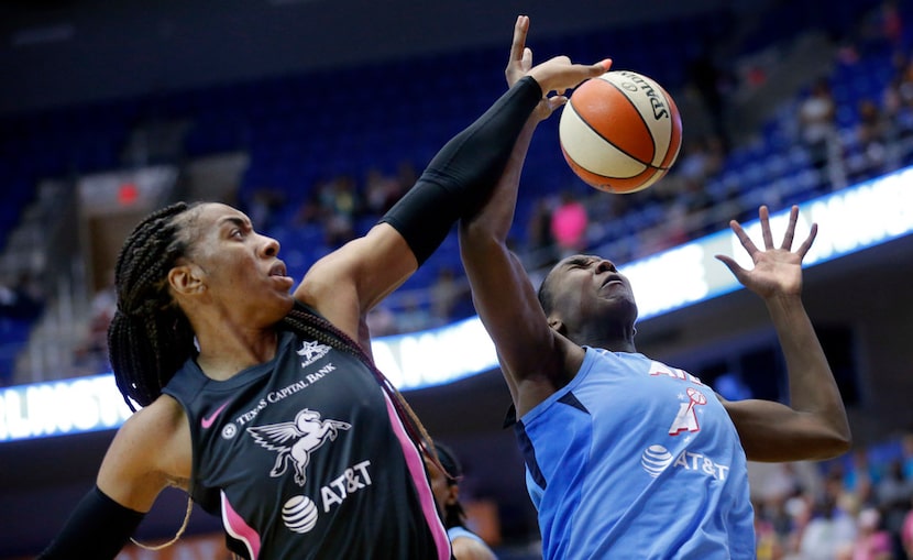 Dallas Wings forward Kayla Thornton (6) tries to get a hand on an offensive rebound from...