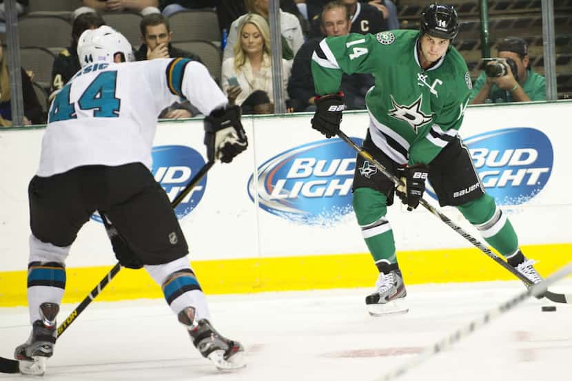 DALLAS, TX - OCTOBER 17:  Jamie Benn #14 of the Dallas Stars controls the puck against the...