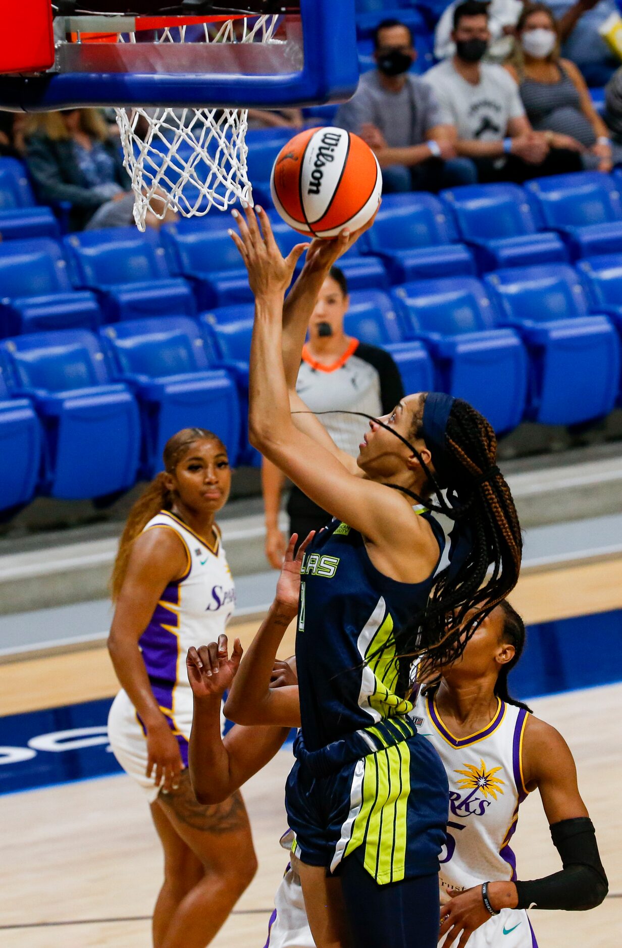 Dallas Wings forward Isabelle Harrison (20) goes for a lay up during the first quarter...