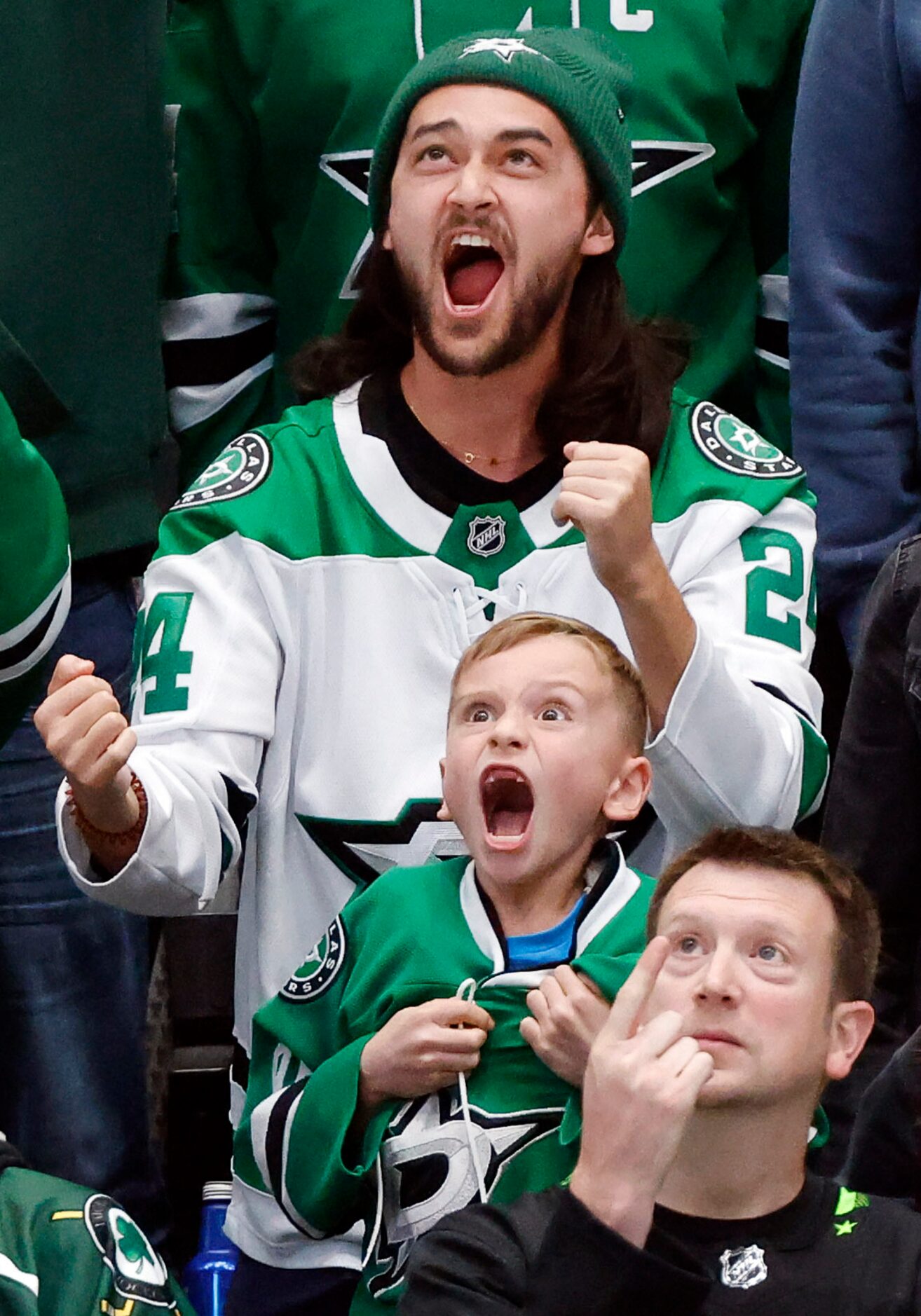 Dallas Stars fans scream as they look to the video board during the third period at the...