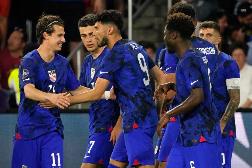 United States forward Ricardo Pepi (9) celebrates with teammates after he scored a goal...