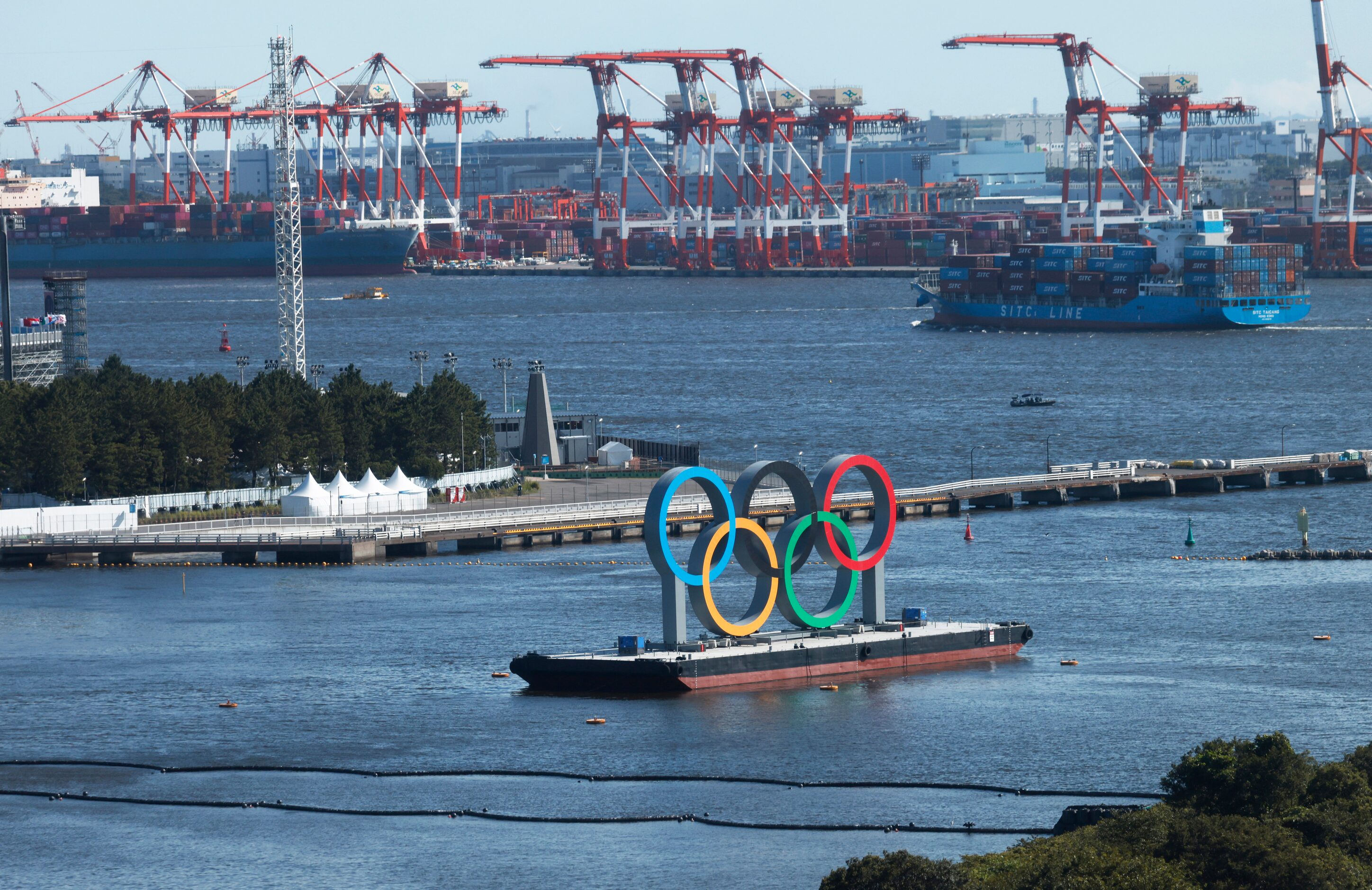 Olympic Rings sit idle in the water during the postponed 2020 Tokyo Olympics on Friday, July...