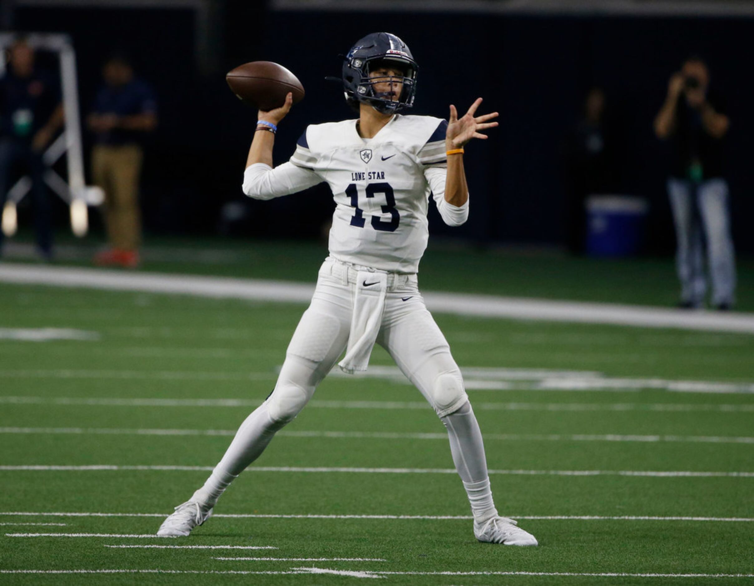 Frisco Lone Star quarterback Garrett Rangel (13) throws against Frisco Wakeland during the...