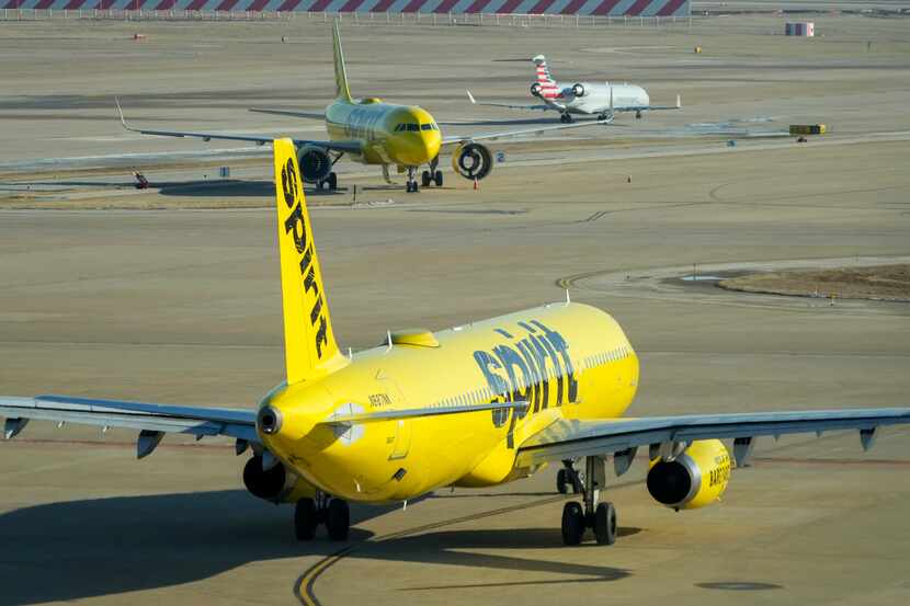 Spirit Airlines planes taxied, along with an American Eagle plane (at top) near Terminal D...