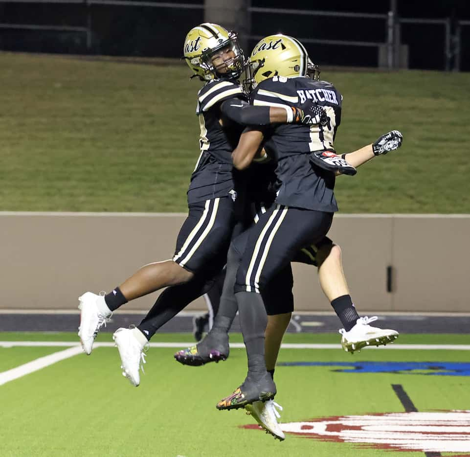 Plano East high WR Jaylon Hatcher (19) celebrates with two teammates, including Caden Warner...